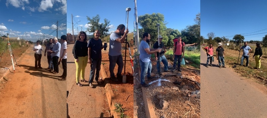 Equipe técnica executando serviços de topografia avançada no terreno
